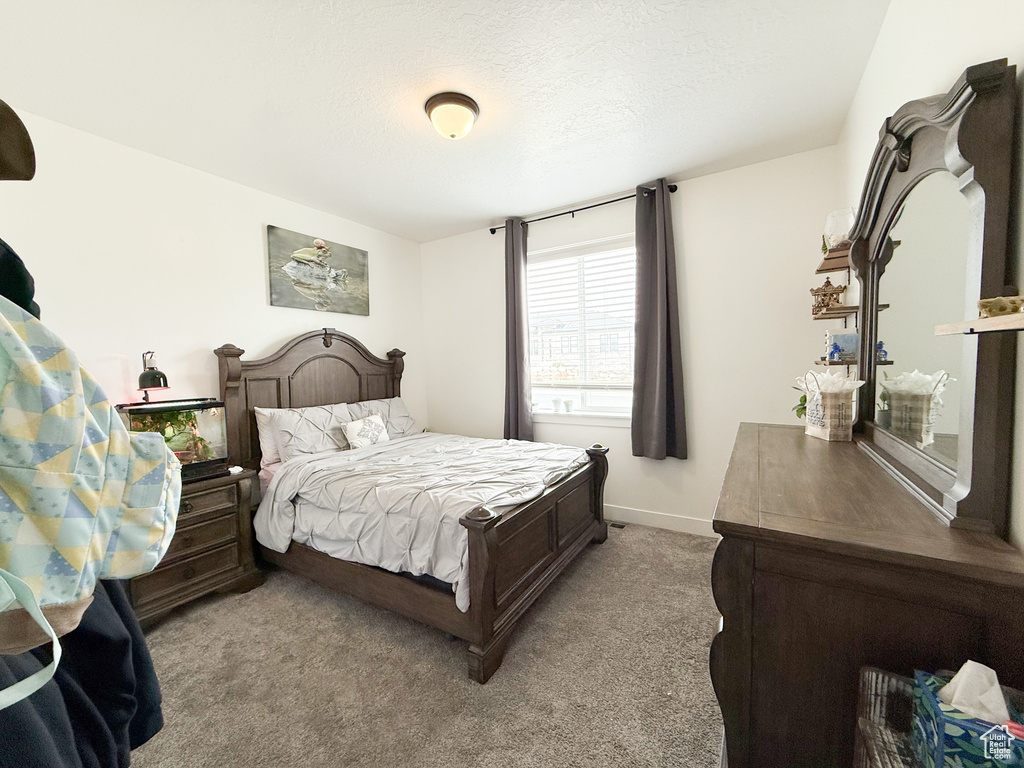 Bedroom with carpet and baseboards
