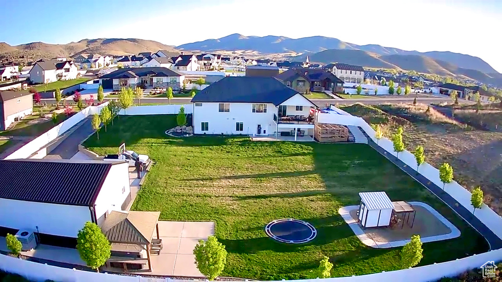 Aerial perspective of suburban area featuring a mountainous background