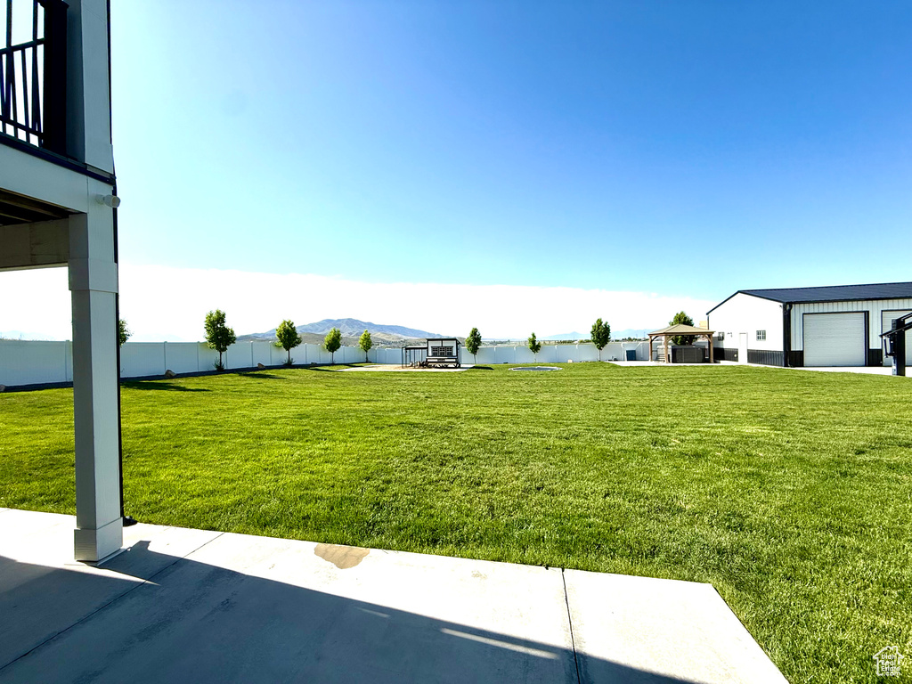 View of yard featuring a water and mountain view