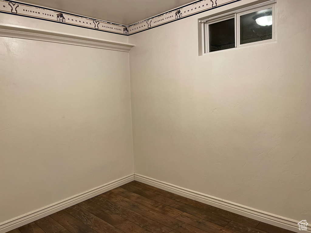 Walk in closet featuring dark wood-style floors