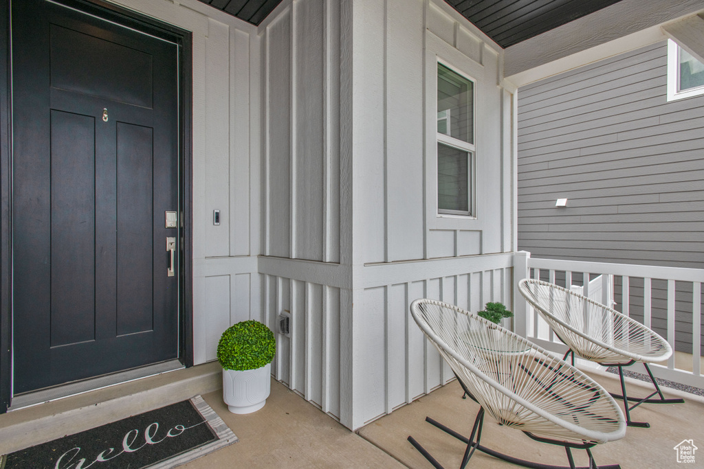 Property entrance with board and batten siding