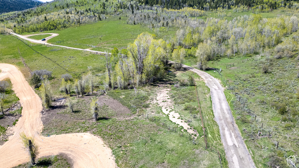 Aerial overview of property\\\\\\\'s location with a mountain backdrop, a forest, and rural landscape