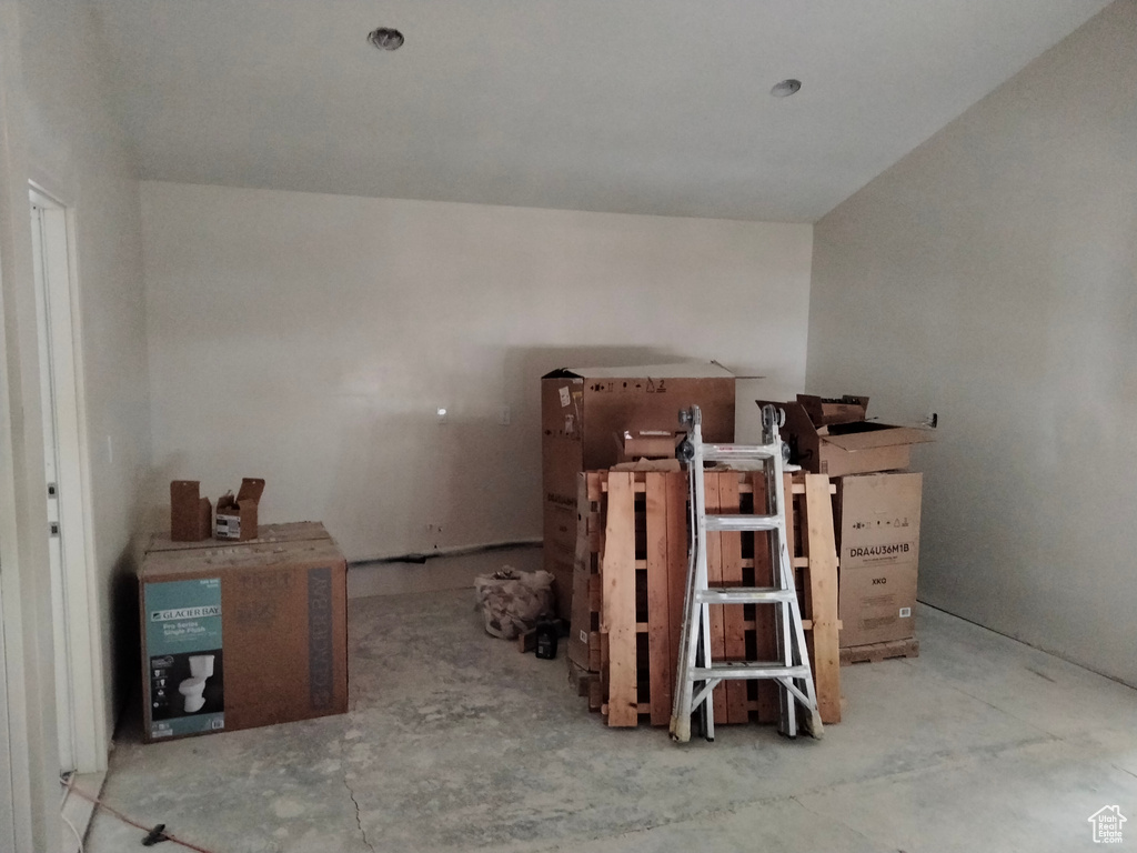 Miscellaneous room featuring unfinished concrete flooring