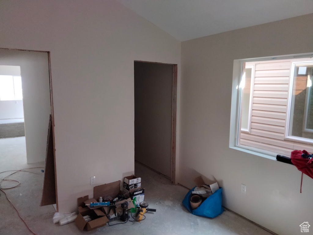 Spare room with vaulted ceiling