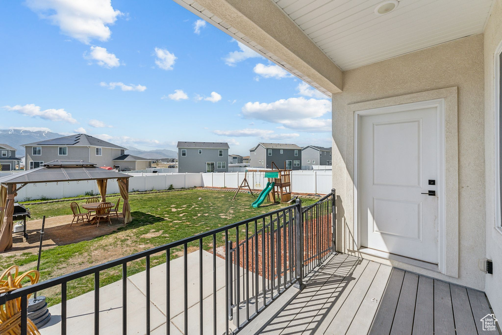 Balcony featuring a residential view and a patio