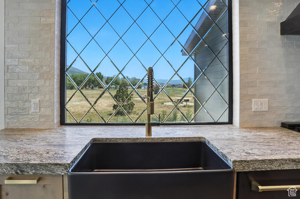 Kitchen view of a sink and backsplash