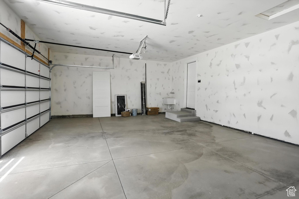 Garage featuring a garage door opener