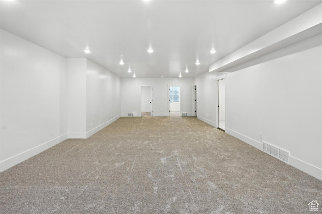 Spare room with recessed lighting and carpet flooring