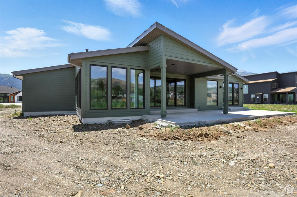 Rear view of house with a patio area
