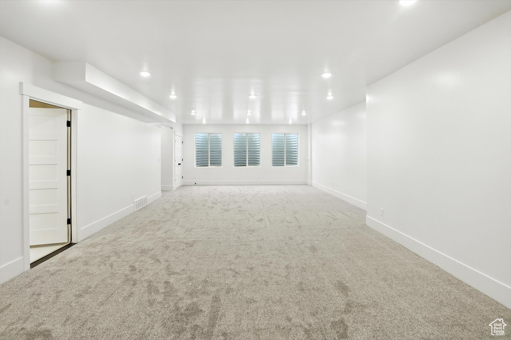Unfurnished room featuring carpet floors and recessed lighting