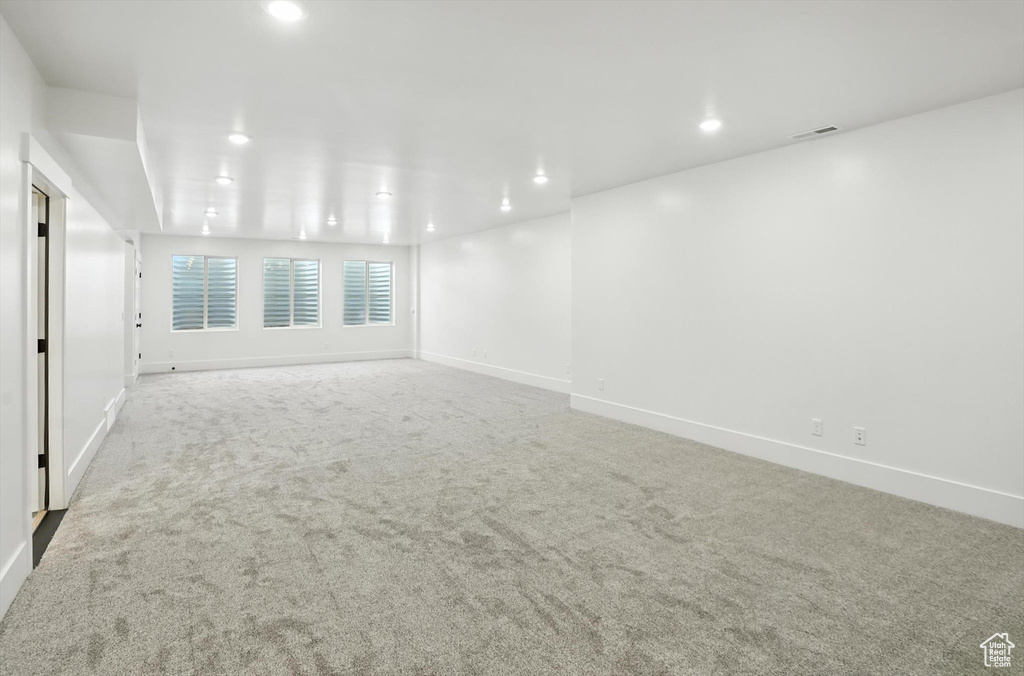 Spare room with carpet flooring and recessed lighting