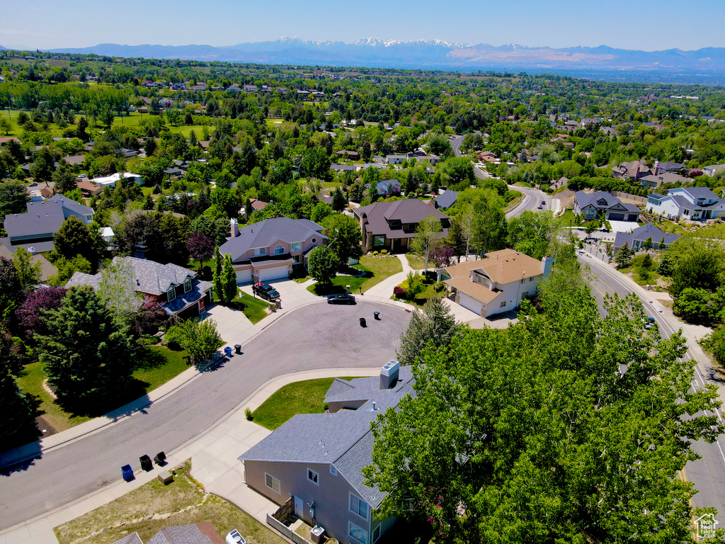 Aerial view of residential area featuring mountains