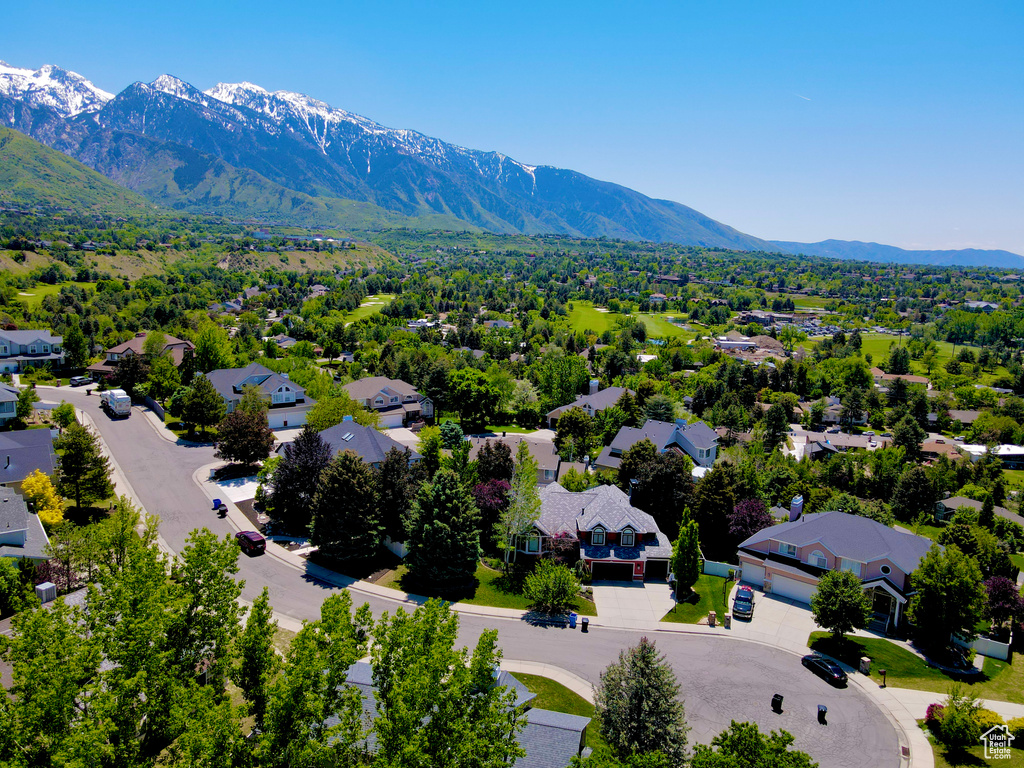 Aerial view of residential area with a mountainous background