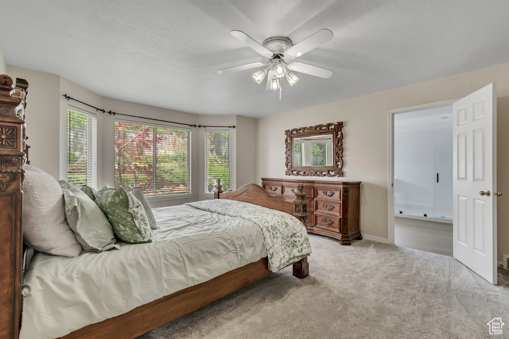 Bedroom featuring carpet floors, ceiling fan, and baseboards