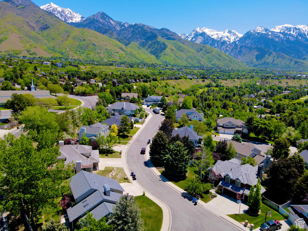 Aerial view of residential area featuring a mountain backdrop