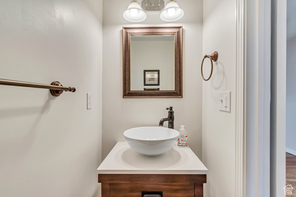Bathroom with vanity and a chandelier