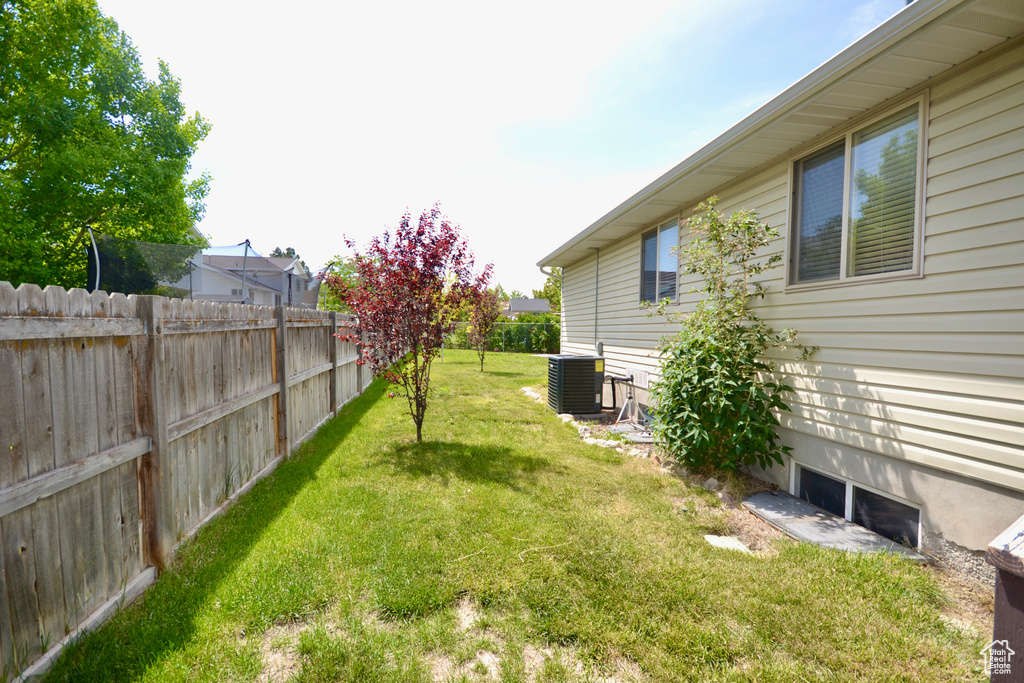 View of yard featuring cooling unit