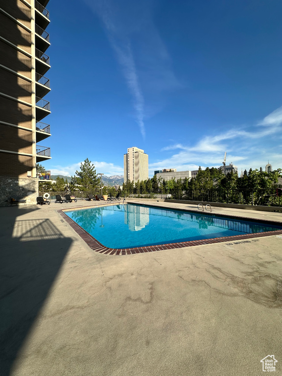 Community pool with a patio area