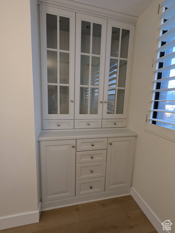 Detailed view of baseboards and wood finished floors