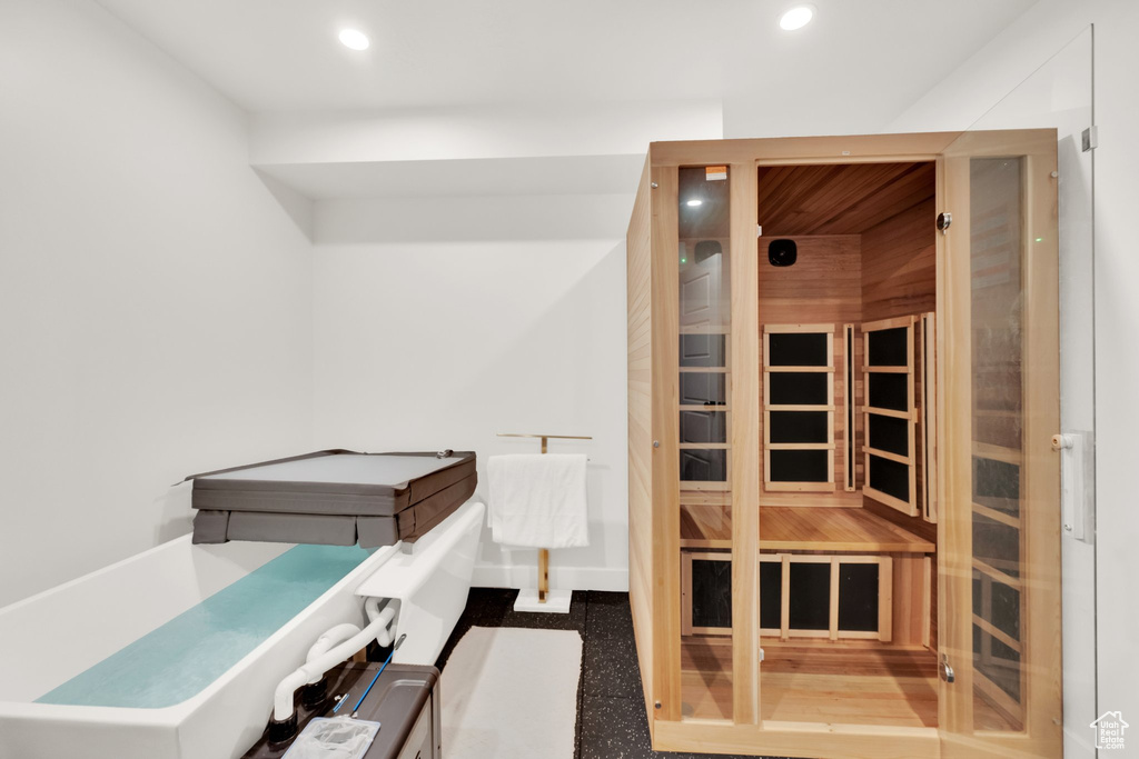 Relaxing sauna / steam room featuring recessed lighting
