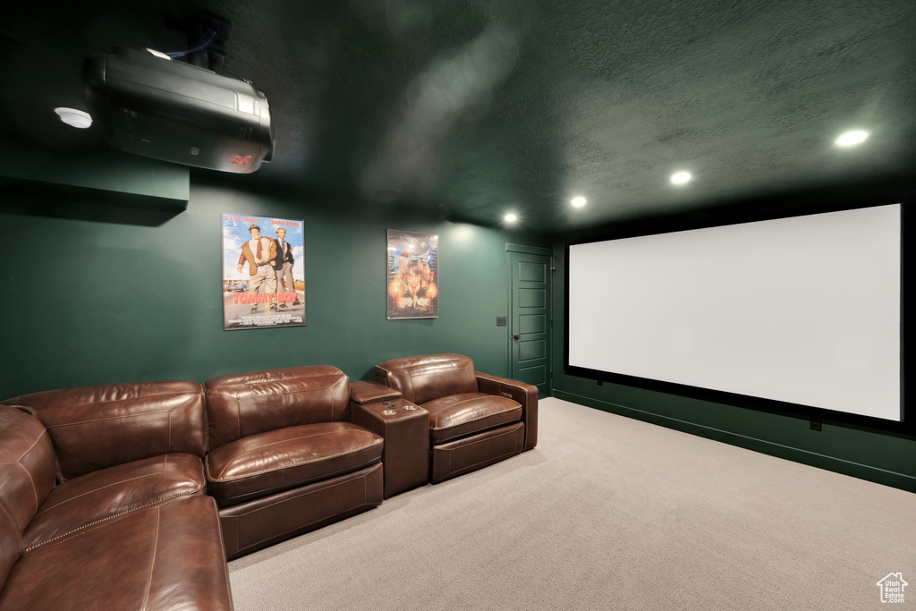 Home theater with recessed lighting, carpet, and a textured ceiling
