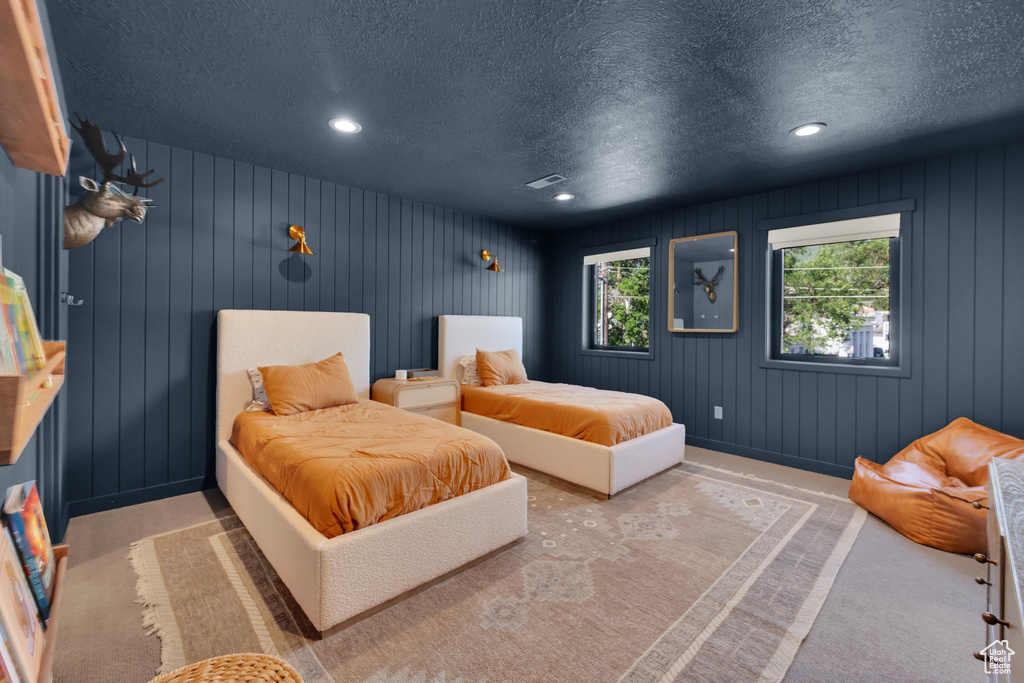 Bedroom featuring a textured ceiling and recessed lighting