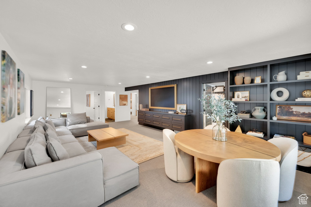 Living room featuring recessed lighting and light carpet
