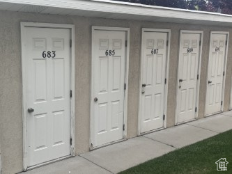 Entrance to property with stucco siding