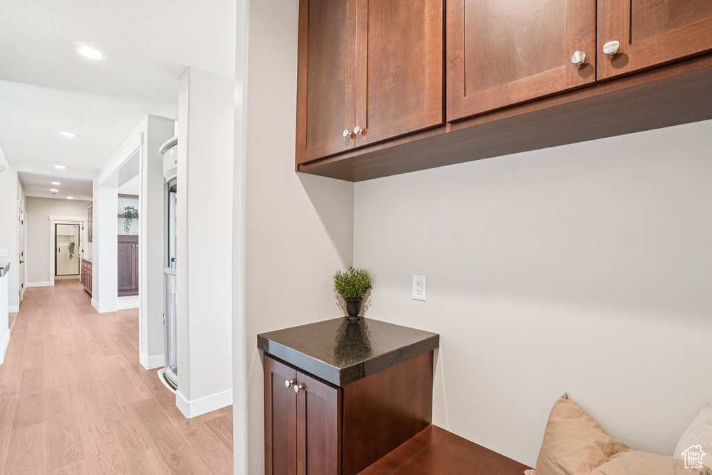 Bar featuring light wood-style floors, recessed lighting, and baseboards