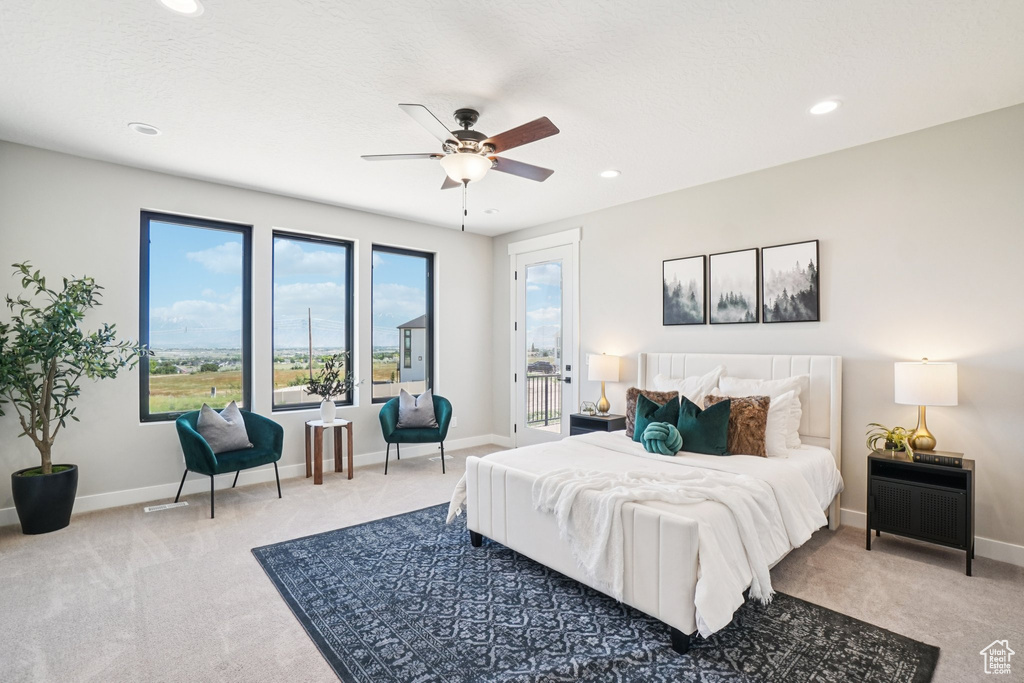 Bedroom featuring light carpet, access to outside, recessed lighting, baseboards, and a ceiling fan