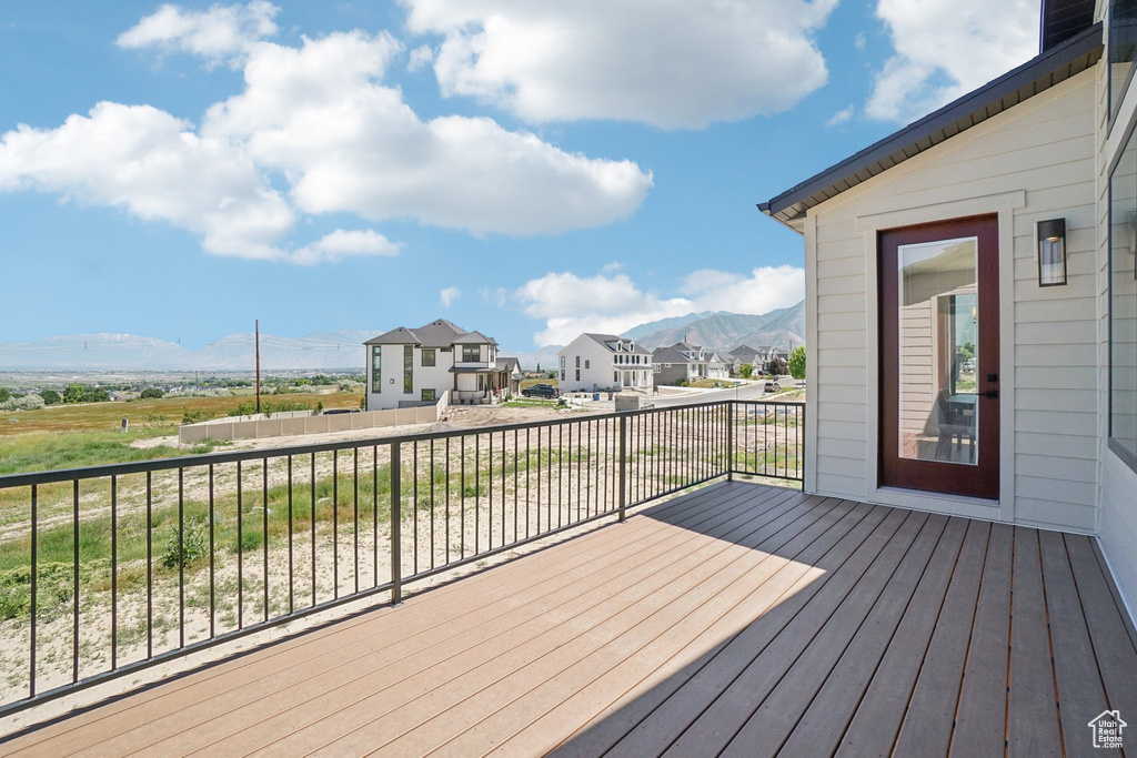 Deck featuring a mountain view and a residential view