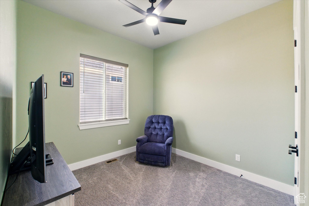 Unfurnished room with ceiling fan, carpet flooring, and baseboards