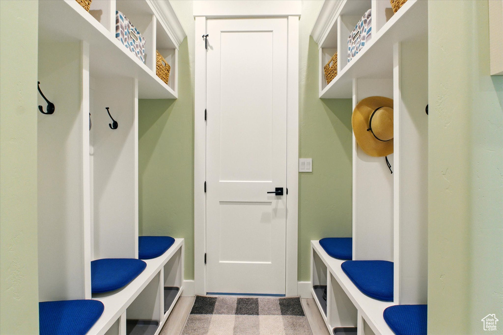 Mudroom with tile patterned floors and baseboards