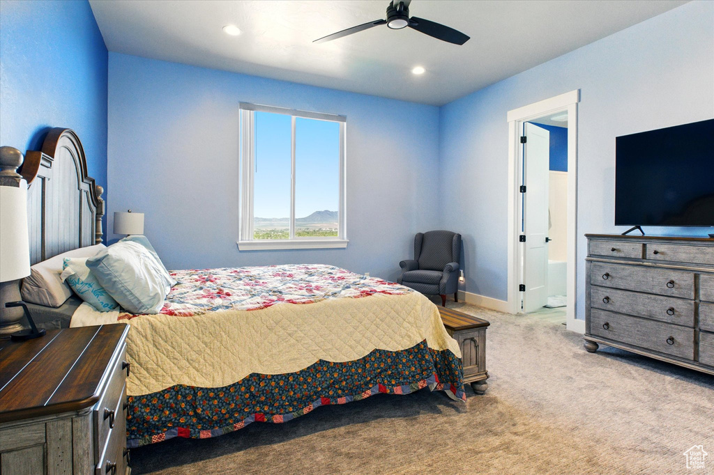 Carpeted bedroom featuring ensuite bath, baseboards, ceiling fan, and recessed lighting