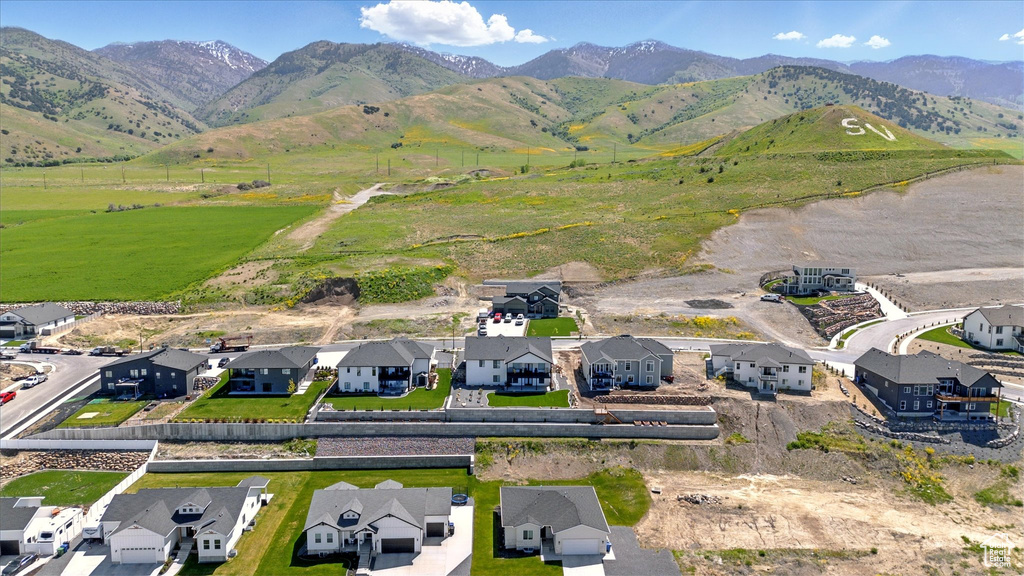 Aerial view of residential area featuring a mountain backdrop