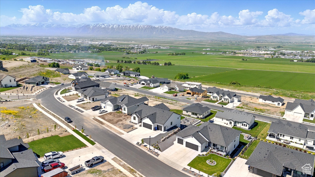 Aerial perspective of suburban area with a mountain backdrop