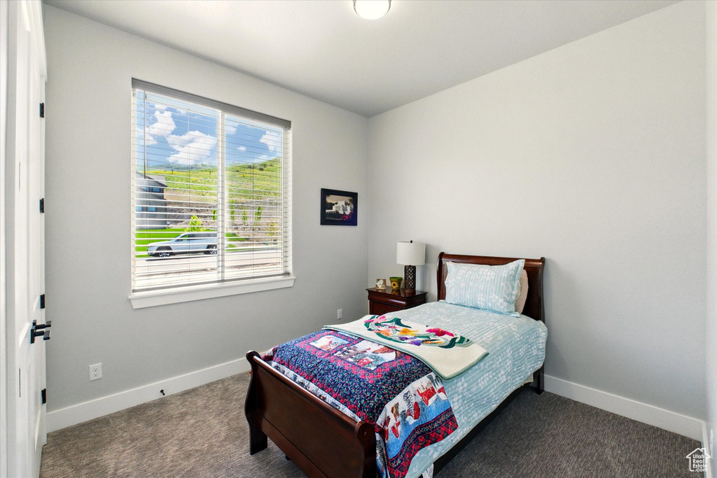 Carpeted bedroom with baseboards