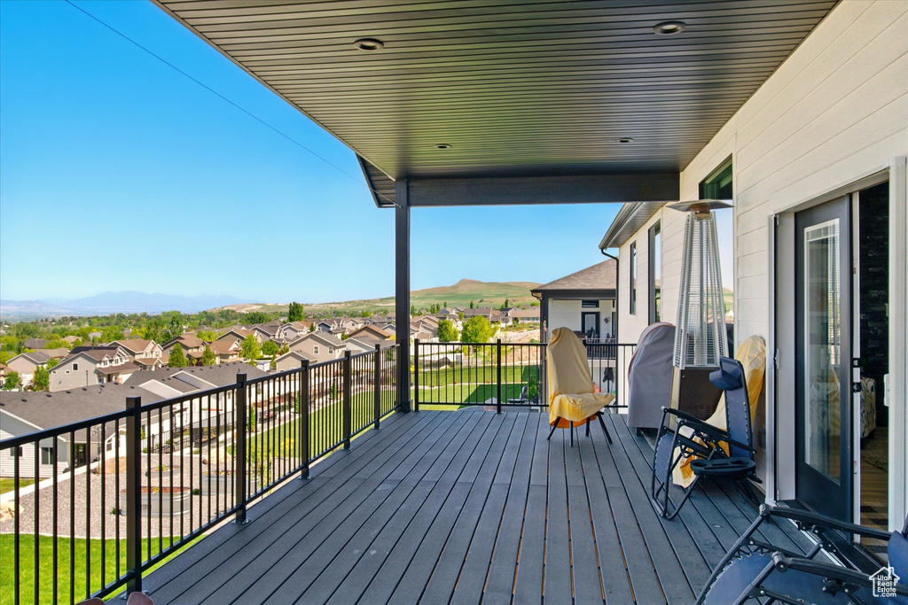 Wooden deck with a mountain view and a residential view