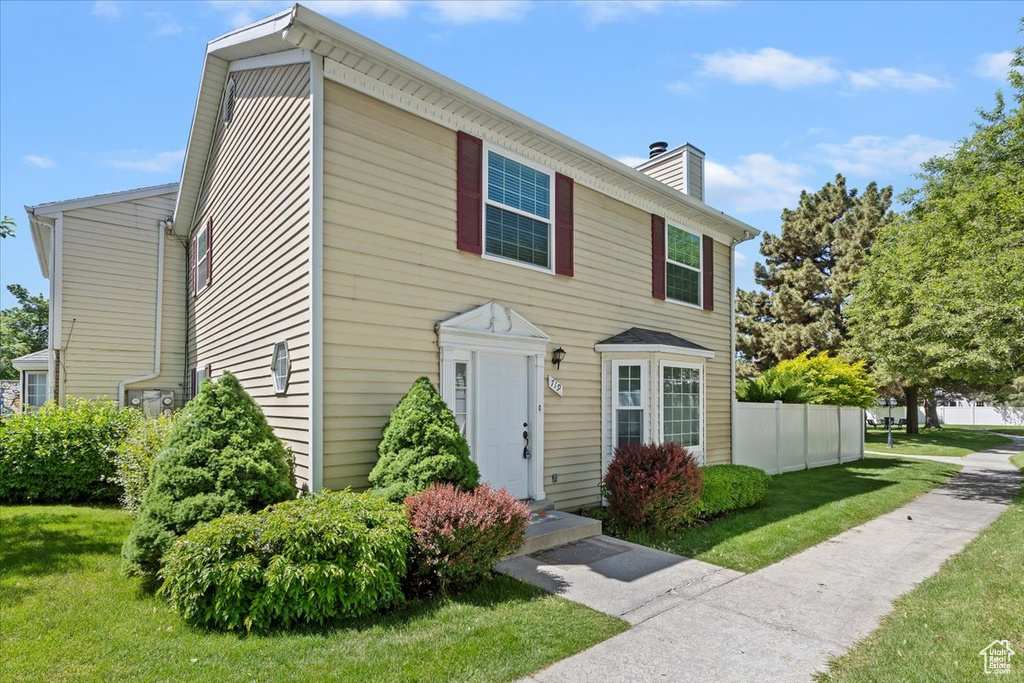 View of front of home with a chimney