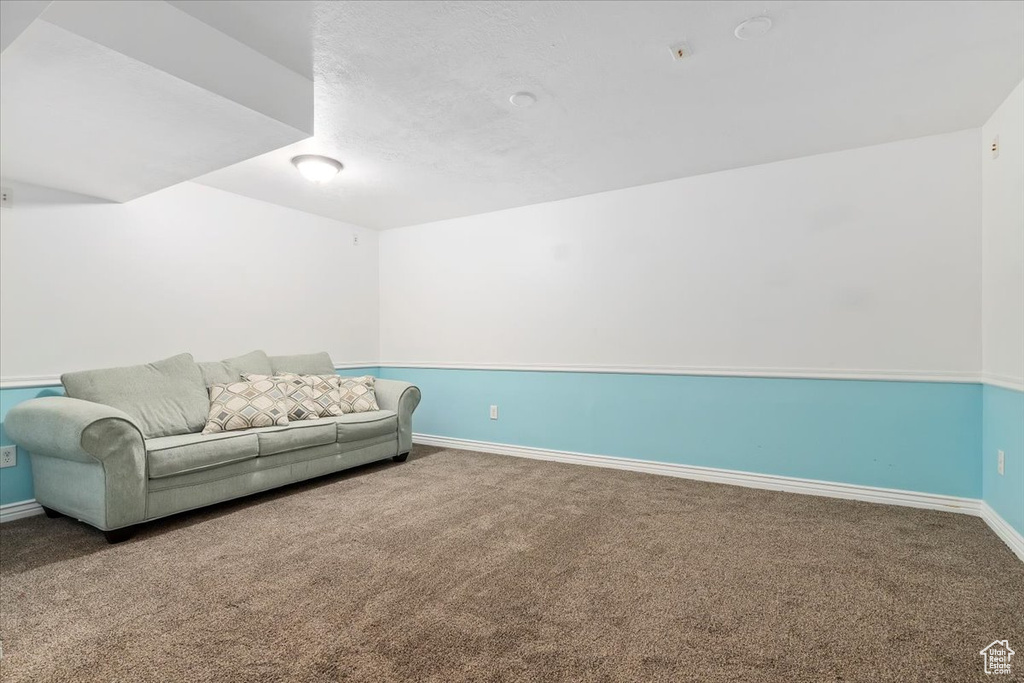 Living area with carpet floors and baseboards