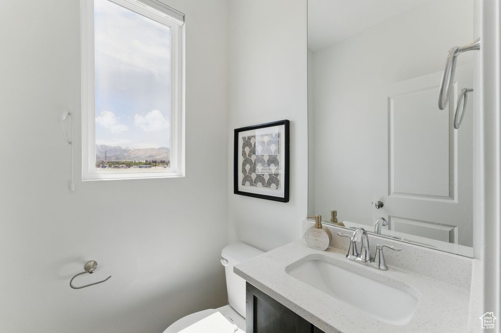 Bathroom featuring toilet and vanity