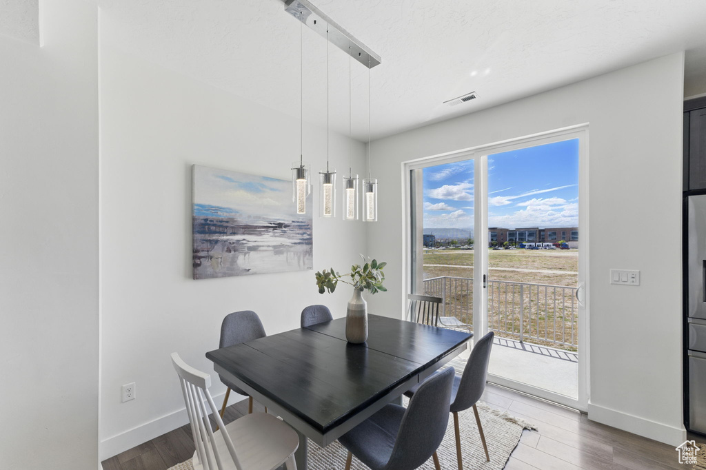 Dining room featuring baseboards and wood finished floors