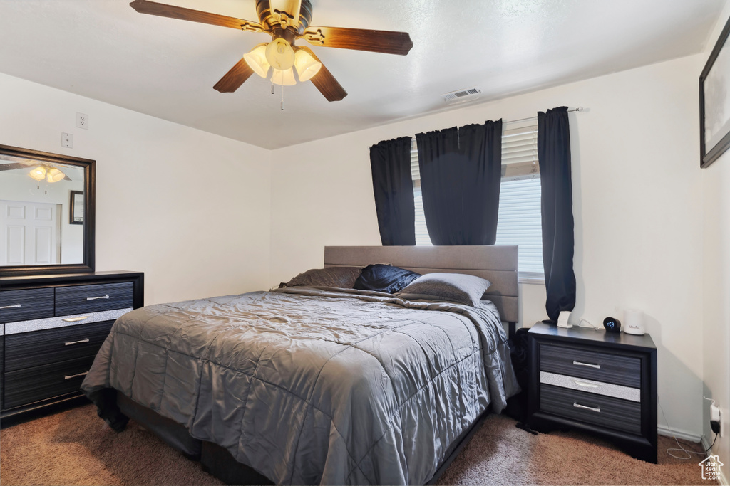 Bedroom with carpet flooring and a ceiling fan