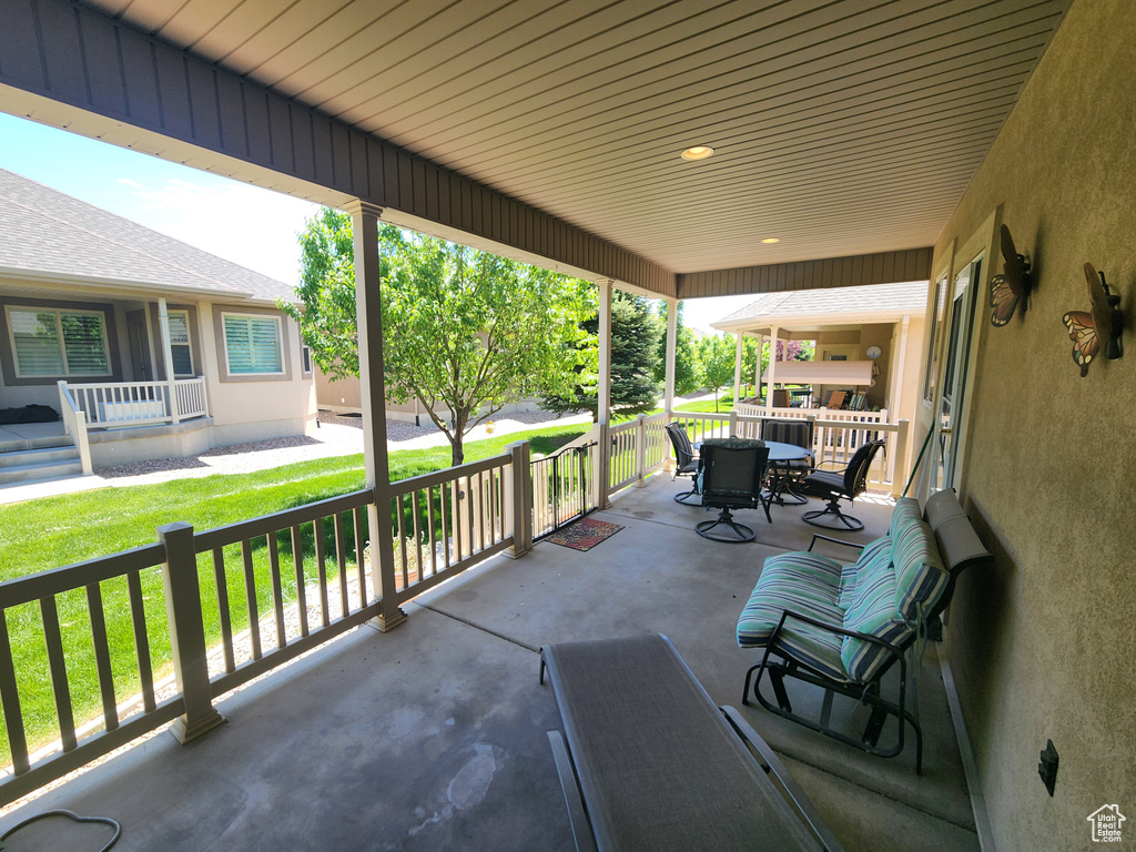 Covered porch with outdoor dining space