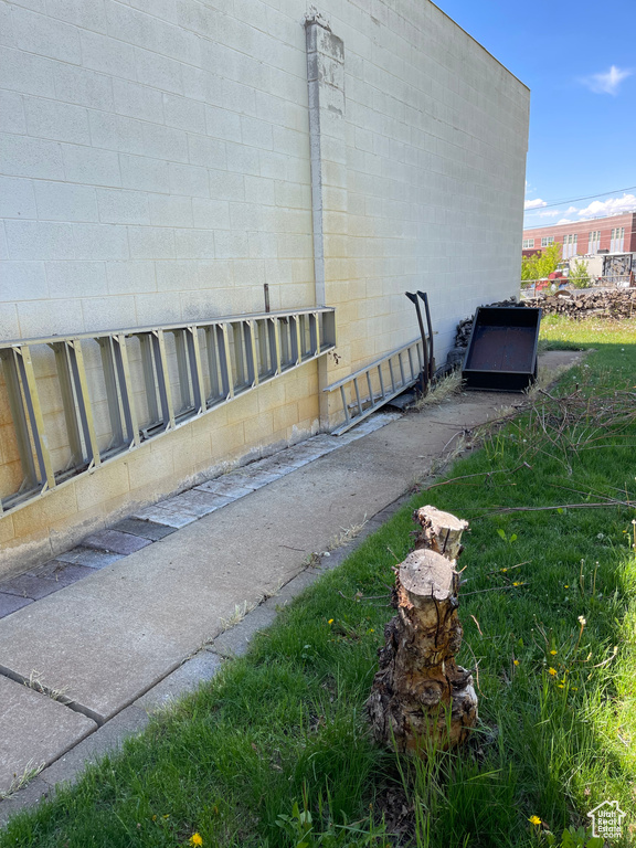 View of side of property with concrete block siding
