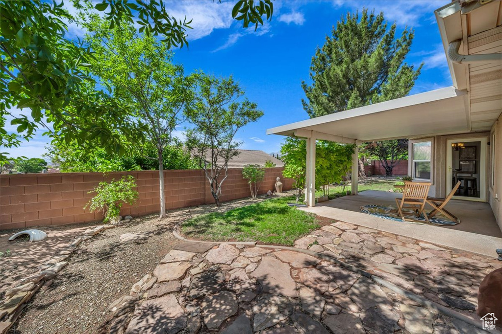 Fenced backyard featuring a patio area