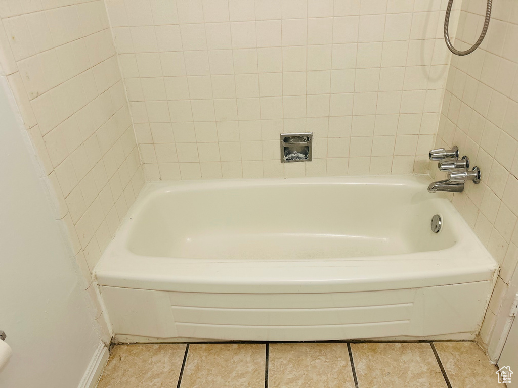 Bathroom featuring tile patterned floors and baseboards