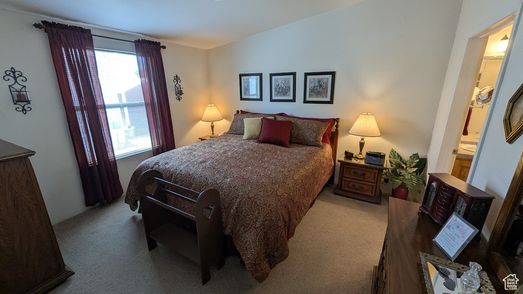 Carpeted bedroom with vaulted ceiling