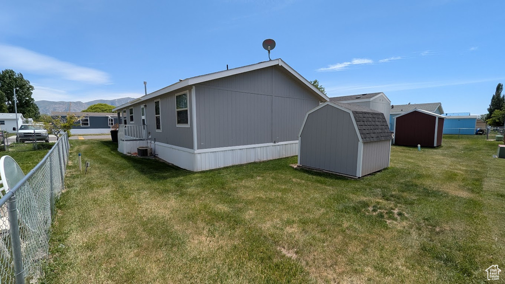Back of property with a mountain view
