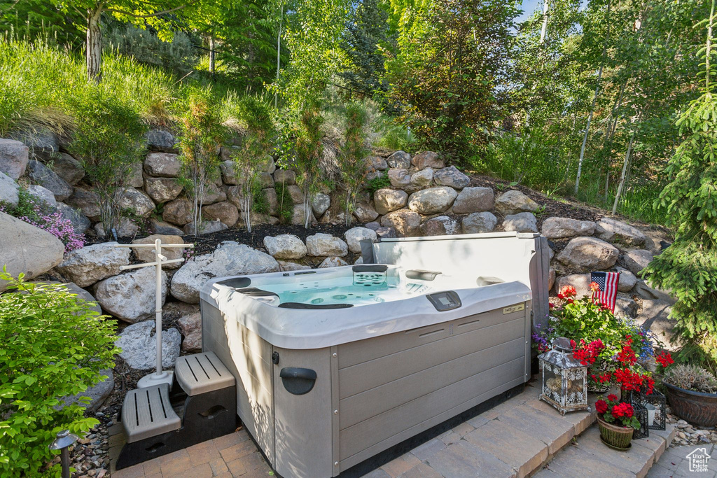 View of patio / terrace with a hot tub